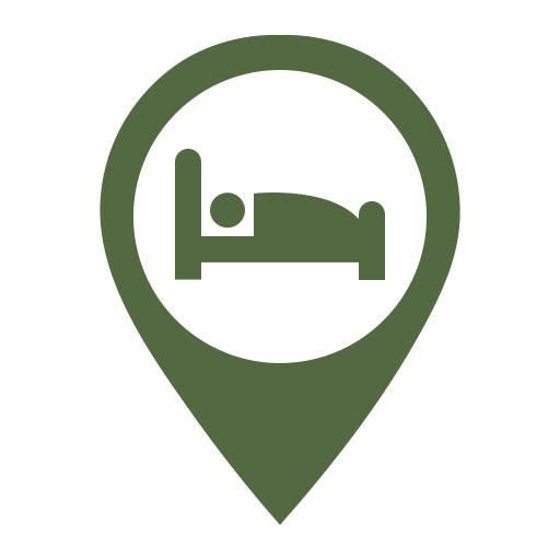 Green map pin with a bed icon representing free lodge drop-off service after the night walk tour.